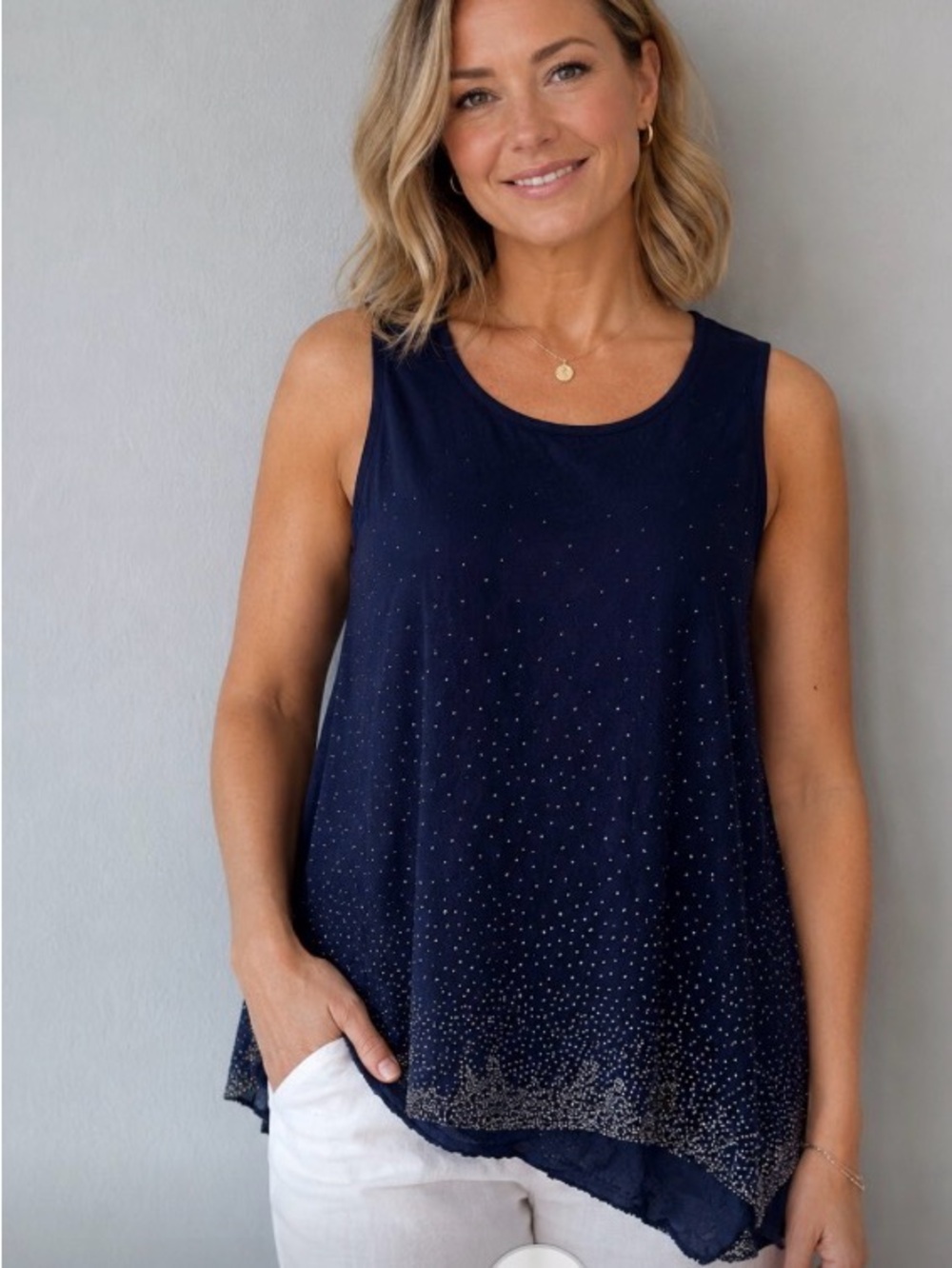 Ecru, delicate bead embellishments and a structured hem flowy NWT